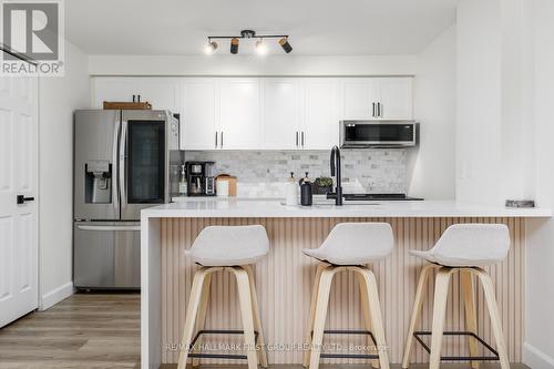208 - 91 Aspen Springs Drive, Clarington, ON - Indoor Photo Showing Kitchen With Upgraded Kitchen