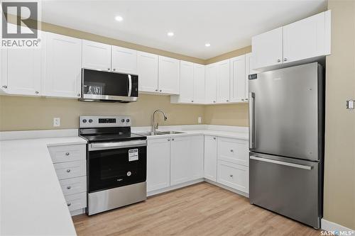 5100 Dewdney Avenue, Regina, SK - Indoor Photo Showing Kitchen With Stainless Steel Kitchen With Double Sink