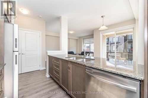 113 - 10 Birmingham Drive, Cambridge, ON - Indoor Photo Showing Kitchen With Double Sink
