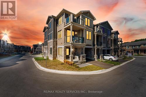 113 - 10 Birmingham Drive, Cambridge, ON - Outdoor With Balcony With Facade
