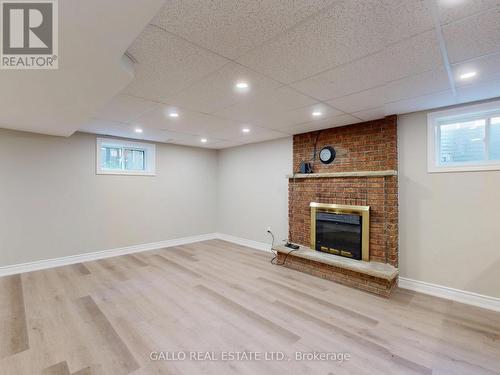 large rec room -electric fireplace - 12151 Tenth Line, Whitchurch-Stouffville, ON - Indoor Photo Showing Basement