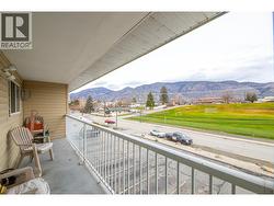 Deck view of the front at 6840 89th st Osoyoos BC with Riccardo Manazza and EXP Realty. - 