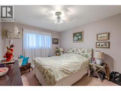 Bedroom 2 view 2 at 6840 89th st Osoyoos BC with Riccardo Manazza and EXP Realty. - 