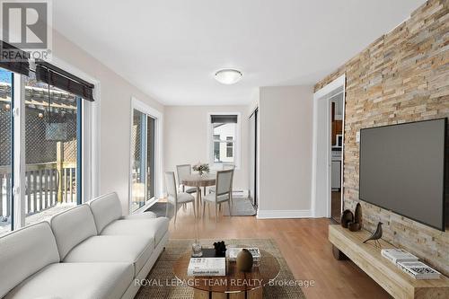 This photograph has been virtually staged - 5584 Manotick Main Street, Ottawa, ON - Indoor Photo Showing Living Room With Fireplace