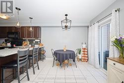 Dining room with doors to the fenced backyard. - 