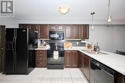 L-shaped counter offering breakfast bar. - 