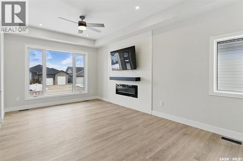 602 Weir Crescent, Warman, SK - Indoor Photo Showing Living Room With Fireplace