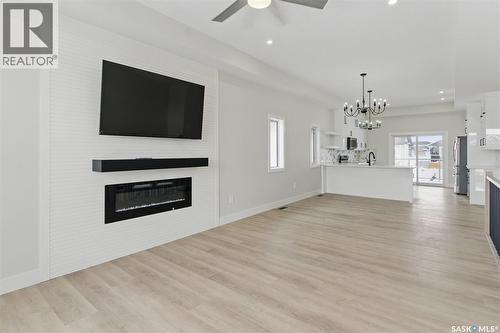 602 Weir Crescent, Warman, SK - Indoor Photo Showing Living Room With Fireplace