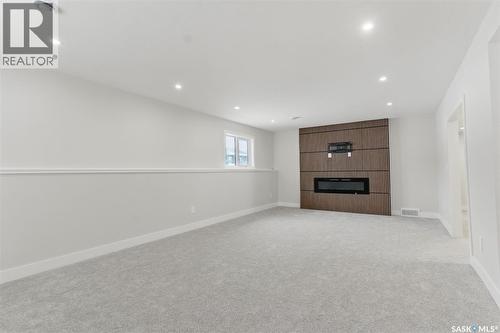 602 Weir Crescent, Warman, SK - Indoor With Fireplace