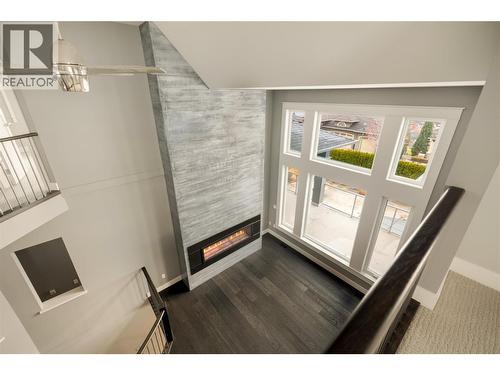 440 Audubon Court, Kelowna, BC - Indoor Photo Showing Other Room With Fireplace