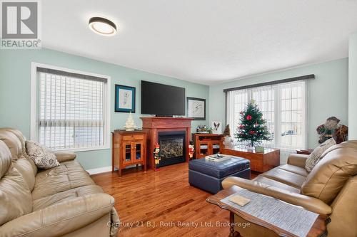 77 Georgia'S Walk, Tay (Victoria Harbour), ON - Indoor Photo Showing Living Room With Fireplace