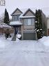 View of front facade with a garage and brick siding - 421 White Birch Avenue, Waterloo, ON  - Outdoor With Facade 
