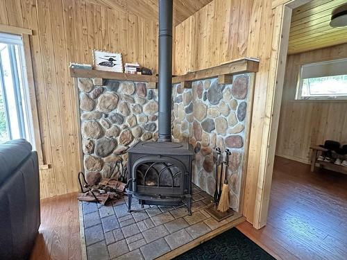 Eagles Nest, Northern Light Lake, ON - Indoor Photo Showing Other Room With Fireplace