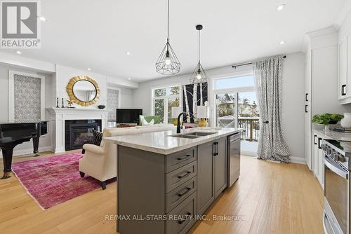 579 Victoria Street, Scugog (Port Perry), ON - Indoor Photo Showing Kitchen With Fireplace With Double Sink