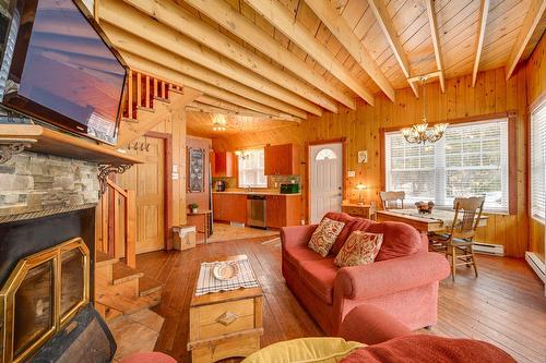 Vue d'ensemble - 6884 Rue De La Rivière, Val-Morin, QC - Indoor Photo Showing Living Room With Fireplace