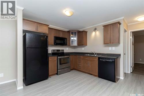 115 115 Dalgleish Link, Saskatoon, SK - Indoor Photo Showing Kitchen With Double Sink