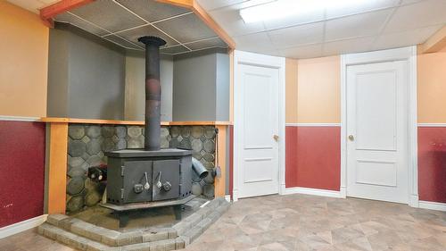 Sous-sol - 216 33E Rue, Notre-Dame-Des-Pins, QC - Indoor Photo Showing Other Room With Fireplace