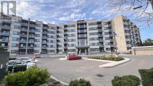 502 - 383 Main Street E, Milton, ON - Outdoor With Balcony With Facade