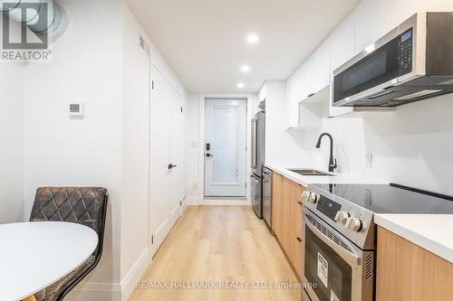 Bsmnt - 700 Adelaide Street W, Toronto, ON - Indoor Photo Showing Kitchen With Double Sink