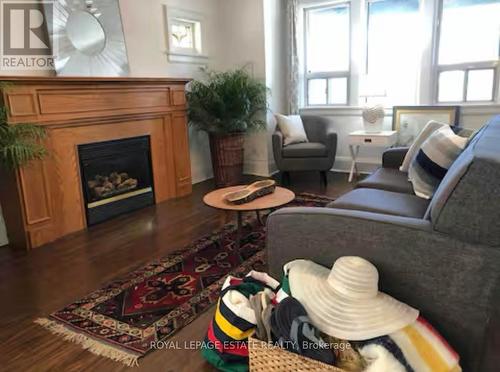 Upper - 62 Scarboro Beach Boulevard, Toronto, ON - Indoor Photo Showing Living Room With Fireplace