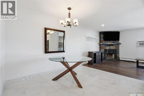 309 3410 Park Street, Regina, SK - Indoor With Fireplace