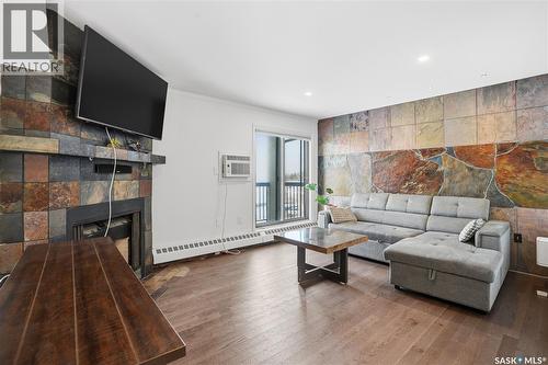 309 3410 Park Street, Regina, SK - Indoor Photo Showing Living Room With Fireplace
