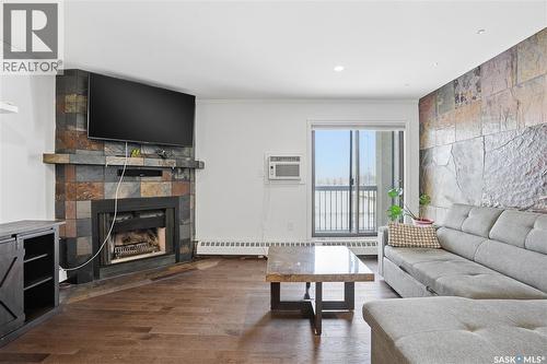 309 3410 Park Street, Regina, SK - Indoor Photo Showing Living Room With Fireplace