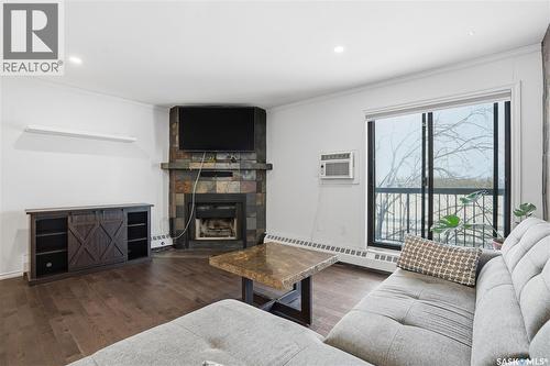 309 3410 Park Street, Regina, SK - Indoor Photo Showing Living Room With Fireplace