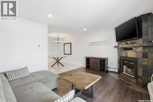 309 3410 Park Street, Regina, SK - Indoor Photo Showing Living Room With Fireplace