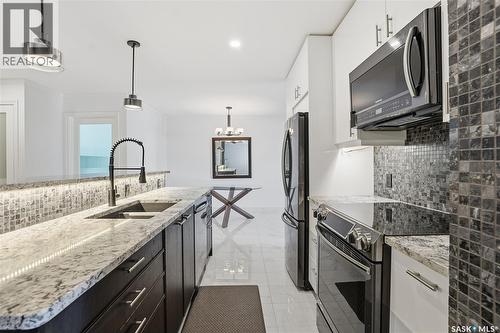 309 3410 Park Street, Regina, SK - Indoor Photo Showing Kitchen With Stainless Steel Kitchen With Double Sink With Upgraded Kitchen