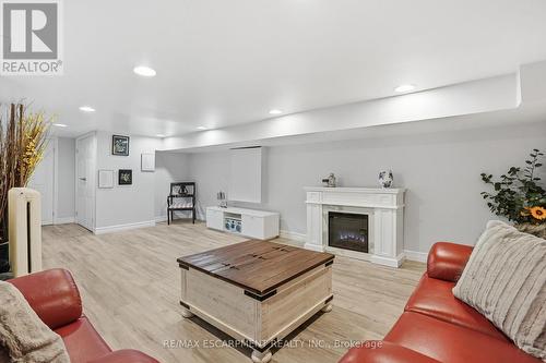 81 Simcoe Street E, Hamilton, ON - Indoor Photo Showing Living Room With Fireplace