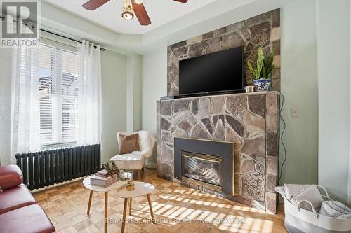 81 Simcoe Street E, Hamilton, ON - Indoor Photo Showing Living Room With Fireplace