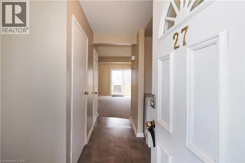 Hallway featuring baseboards and a textured ceiling - 255 Northlake Drive Unit# 27, Waterloo, ON - Indoor Photo Showing Other Room