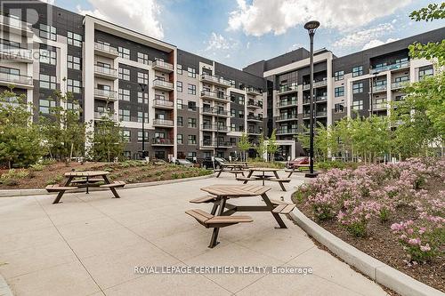 435 - 128 Grovewood Common, Oakville, ON - Outdoor With Facade
