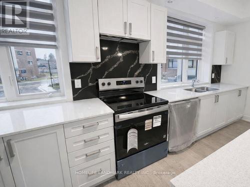 253 - 1095 Douglas Mccurdy Common, Mississauga, ON - Indoor Photo Showing Kitchen With Double Sink With Upgraded Kitchen