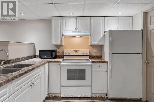 Stovetop, Oven, Fridge, Countertop Microwave - Lower - 11 Broadmore Avenue, St. Catharines, ON - Indoor Photo Showing Kitchen With Double Sink