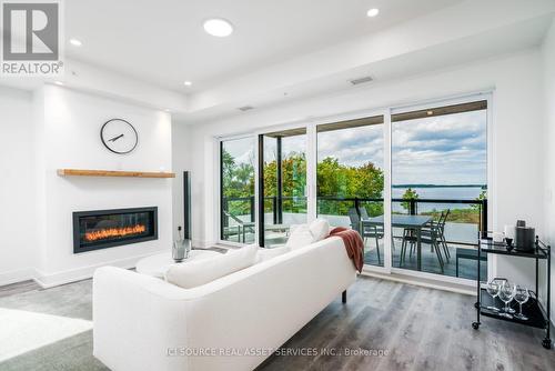 208 - 19B West Street N, Kawartha Lakes, ON - Indoor Photo Showing Living Room With Fireplace