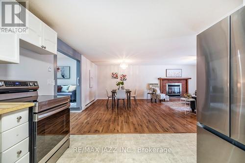 119 Wilmot Trail, Clarington (Bowmanville), ON - Indoor Photo Showing Kitchen With Fireplace