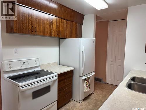 67 Milford Crescent, Regina, SK - Indoor Photo Showing Kitchen With Double Sink