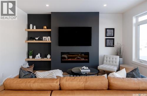 143 Cockcroft Manor, Saskatoon, SK - Indoor Photo Showing Living Room With Fireplace