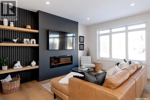 143 Cockcroft Manor, Saskatoon, SK - Indoor Photo Showing Living Room With Fireplace