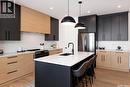 143 Cockcroft Manor, Saskatoon, SK  - Indoor Photo Showing Kitchen With Upgraded Kitchen 