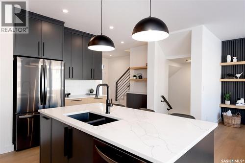 143 Cockcroft Manor, Saskatoon, SK - Indoor Photo Showing Kitchen With Double Sink With Upgraded Kitchen