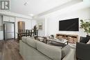 Virtually Staged - 126 - 1585 Rose Way, Milton, ON  - Indoor Photo Showing Living Room 