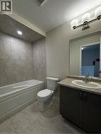 Bathroom with vanity and shower / bath combination - 