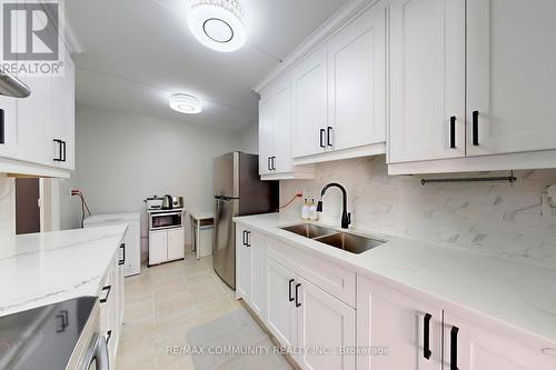 213 - 2 Glamorgan Avenue, Toronto, ON - Indoor Photo Showing Kitchen With Double Sink