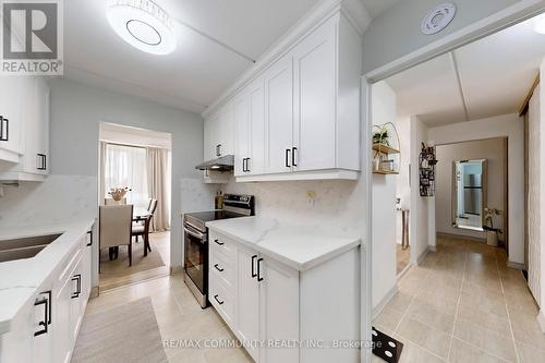 213 - 2 Glamorgan Avenue, Toronto, ON - Indoor Photo Showing Kitchen With Double Sink