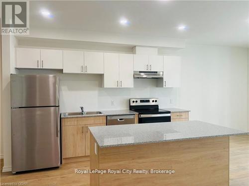 311B - 181 Elmira Road S, Guelph (Willow West/Sugarbush/West Acres), ON - Indoor Photo Showing Kitchen With Stainless Steel Kitchen With Double Sink With Upgraded Kitchen