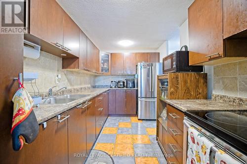 306 - 3120 Kirwin Avenue, Mississauga, ON - Indoor Photo Showing Kitchen With Double Sink
