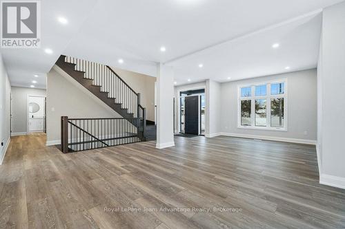 Staircase And Living Room - 18 Avery Court, Parry Sound, ON - Indoor Photo Showing Other Room